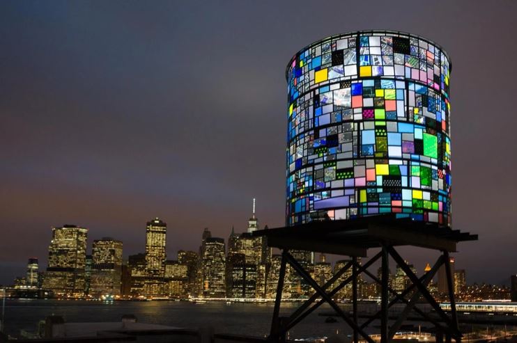 stain glass water tower, nighttime city skyline in background